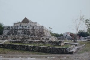 Mayapan pyramid ruin with Thatch Roof